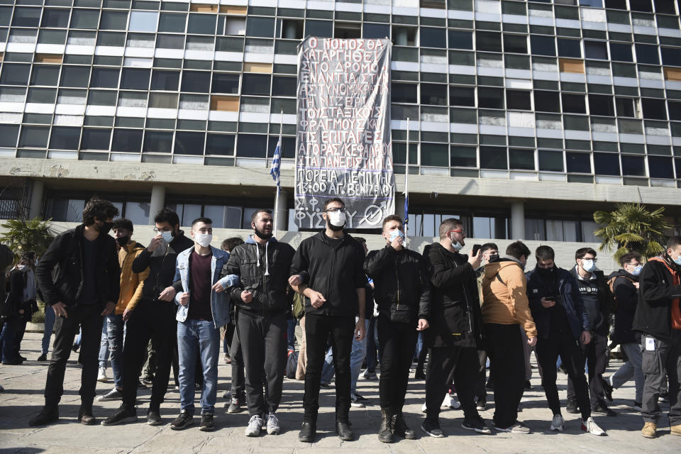 Protesters chant slogans at the University of Thessaloniki in northern Greece, on Monday, Feb. 22, 2021. Police clashed with protesters and detained more than 30 people in Greece's second-largest city Monday during a demonstration against a new campus security law. (AP Photo/Giannis Papanikos)