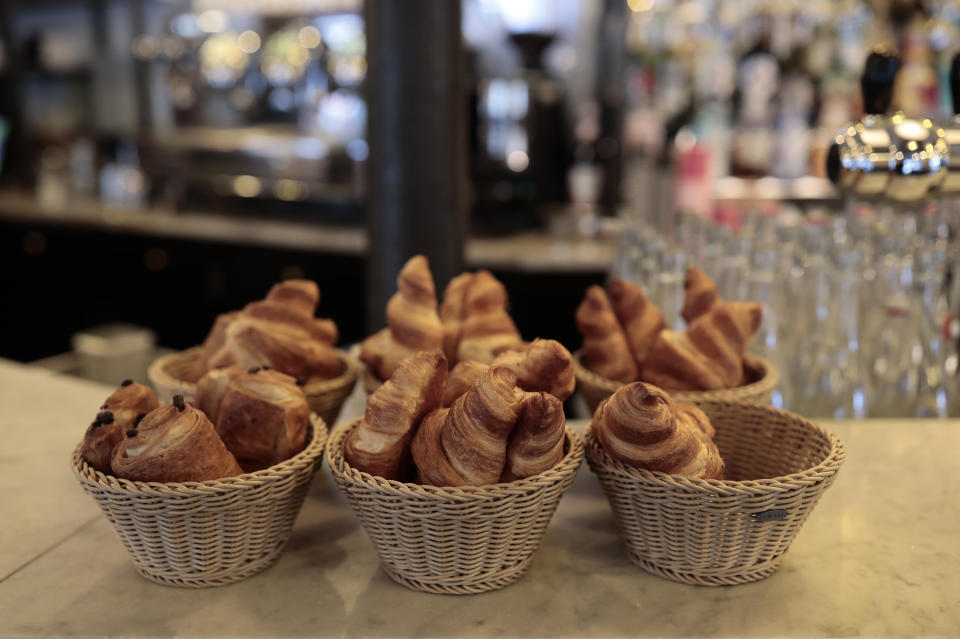 Croissants are pictured in a cafe in Paris, Wednesday, May, 19, 2021. It's a grand day for the French. Café and restaurant terraces are reopening Wednesday after a shutdown of more than six months deprived people of what feels like the essence of life — sipping coffee and wine with friends outdoors — to save lives during the coronavirus pandemic. (AP Photo/Lewis Joly)