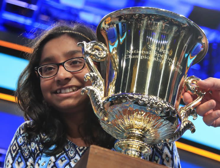 Ananya Vinay holds her trophy after being declared the winner of the 90th Scripps National Spelling Bee