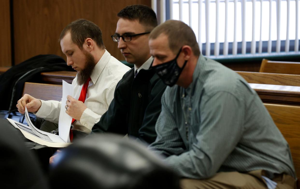 Joseph Morrison, Paul Bellar and Pete Musico wait for their hearing to start in the courtroom of Judge Thomas Wilson at the Jackson County Circuit Court in Jackson on Wednesday, Feb. 23, 2022. All three were in court regarding the Gov. Gretchen Whitmer kidnapping plot they were allegedly involved in.