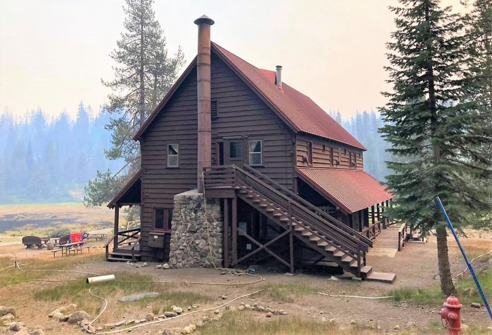 Lassen Volcanic National Park officials say a combination of "heroic firefighting," the clearing of defensible space and a water sprinkler saved the Drakesbad Guest Ranch from being destroyed by the Dixie Fire on Aug. 12, 2021.