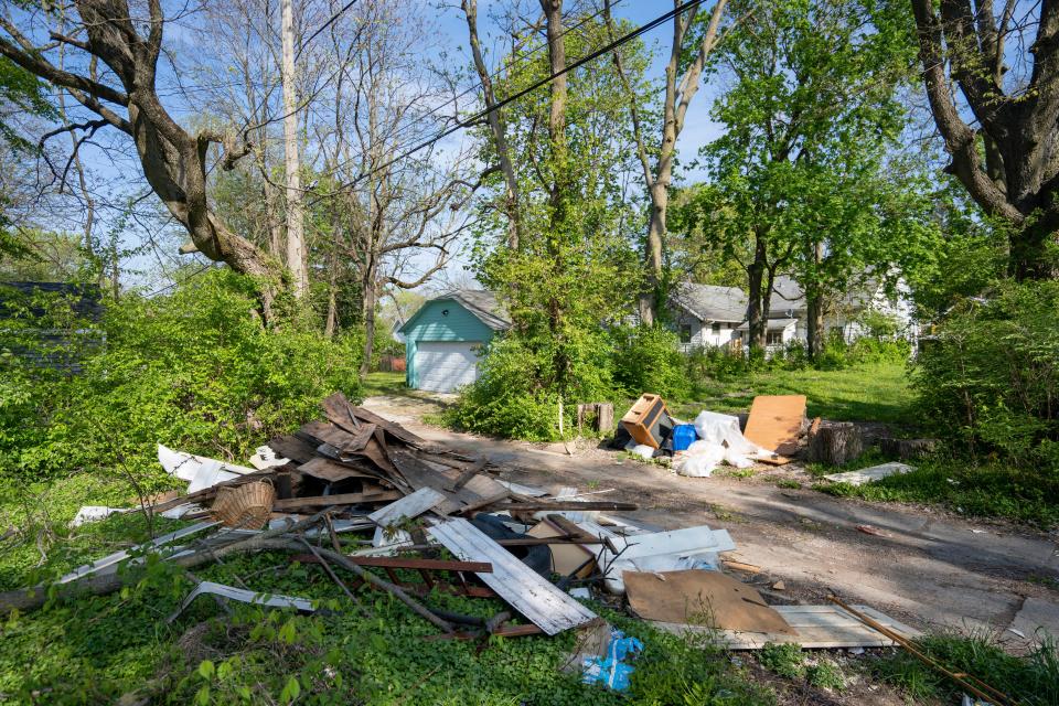 Trash litters the alley between 33rd St. and 34th St. on the west side of Indianapolis Wednesday, April 26, 2023.