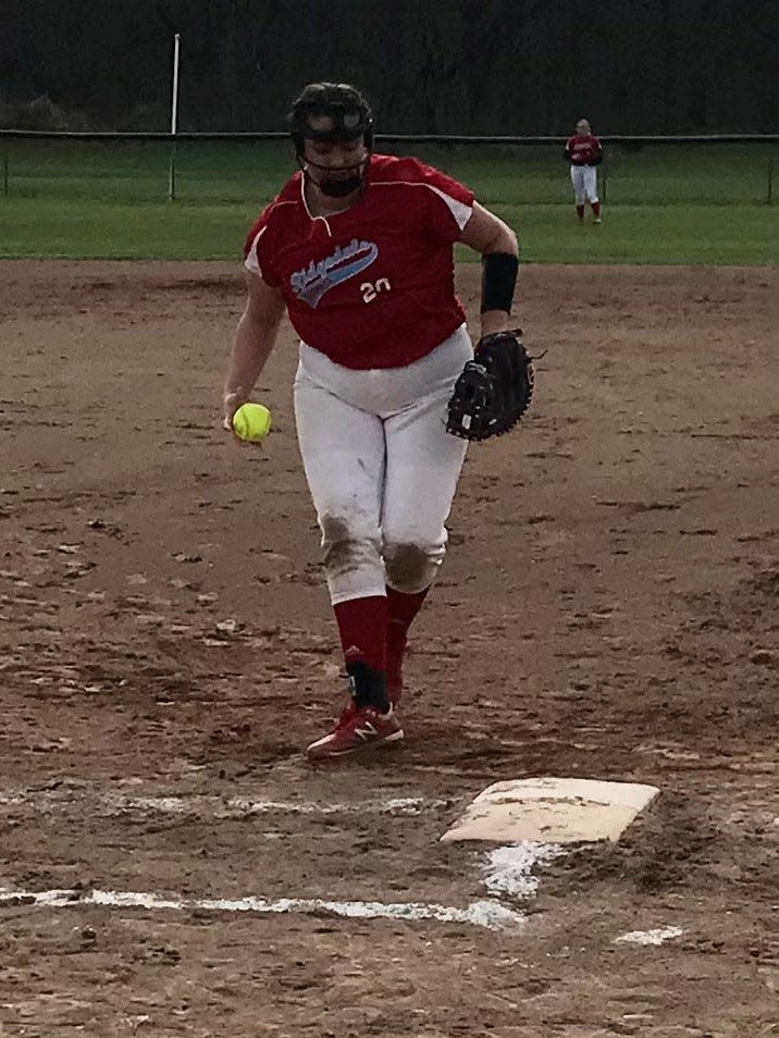 Ridgedale's Abigail Bridges delivers a pitch during a home softball game against Elgin last year.