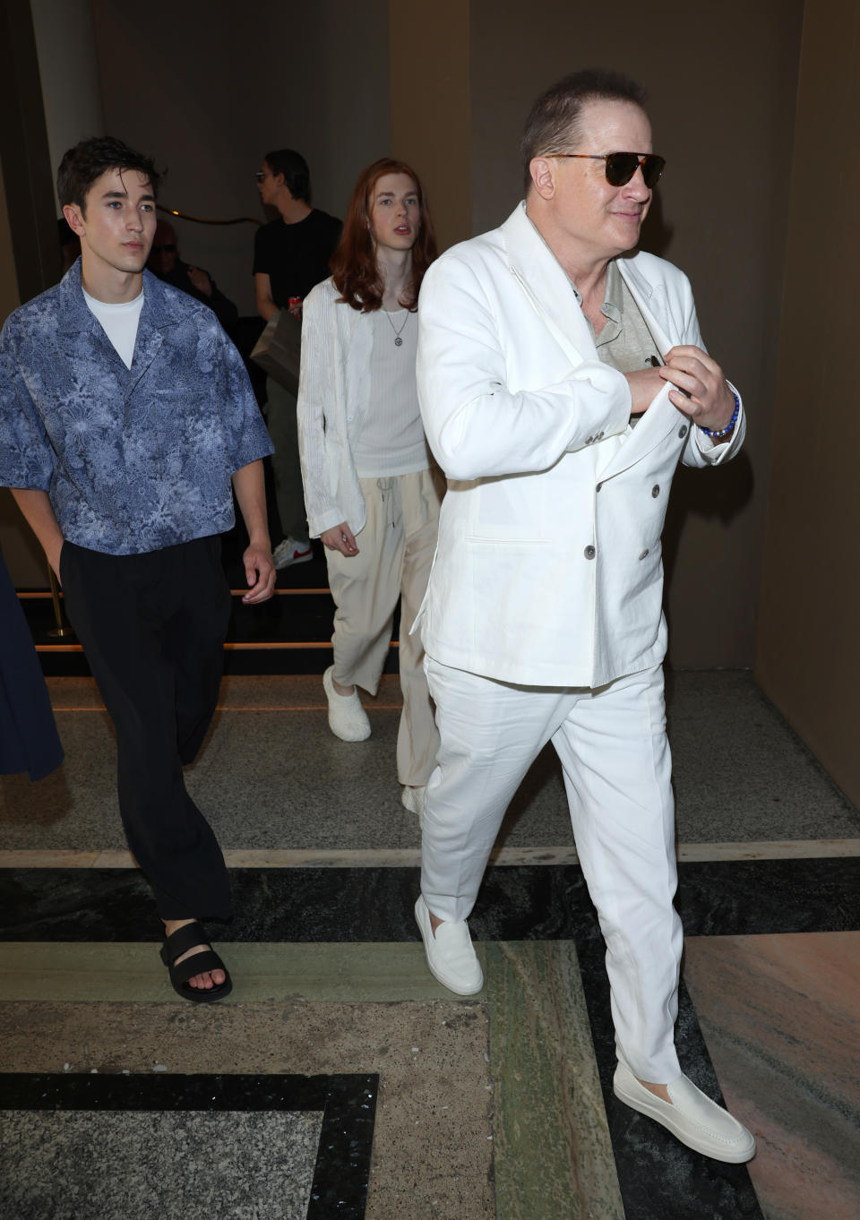 MILAN, ITALY - JUNE 19:  Brendan Fraser with his sons Holden Fraser (L) and Leland Fraser (C) are seen departing the Giorgio Armani Spring/Summer 2024 fashion show during the Milan Fashion Week menswear spring/summer 2024 on June 19, 2023 in Milan, Italy. (Photo by Jacopo Raule/Getty Images)