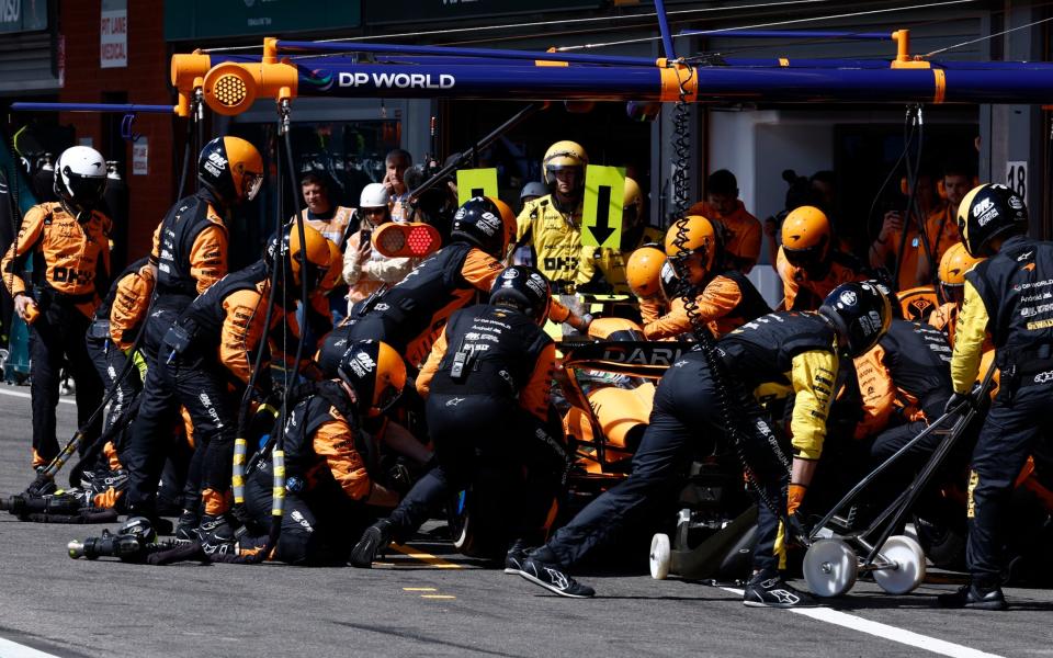 Crew work on the car of McLaren driver Oscar Piastri of Australia during the Formula One Grand Prix at the Spa-Francorchamps racetrack in Spa, Belgium, Sunday, July 28, 2024