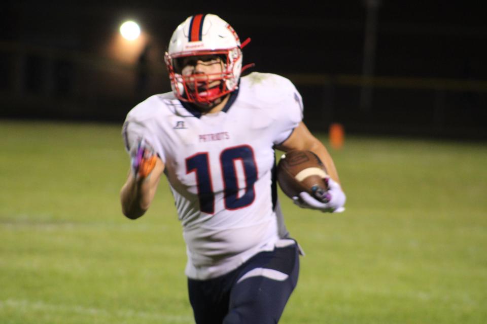 Britton Deerfield's Colin Johnson runs with the ball after a catch during a game in the 2023 season.
