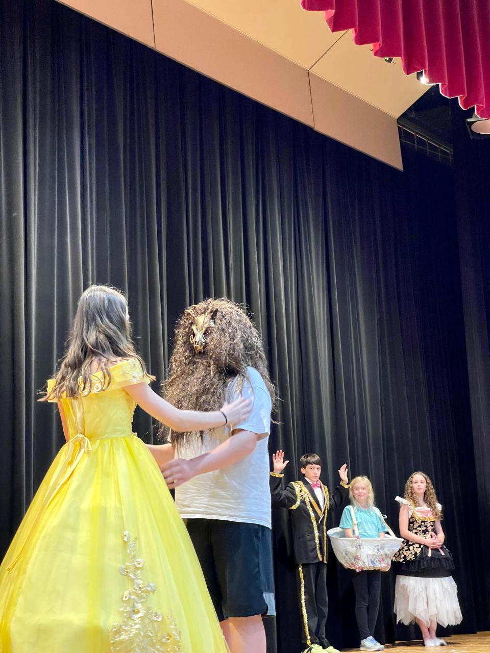 Veda Farr as Belle and Liam Milbourn as The Beast rehearse their ballroom dance.