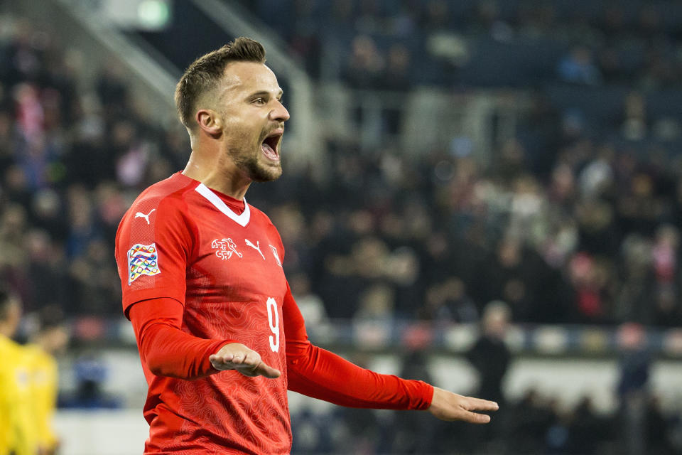 Switzerland's Haris Seferovic celebrates scoring during the UEFA Nations League soccer match between Switzerland and Belgium at the swissporarena stadium in Lucerne, Switzerland, on Sunday, Nov. 18, 2018. (Alexandra Wey/Keystone via AP)