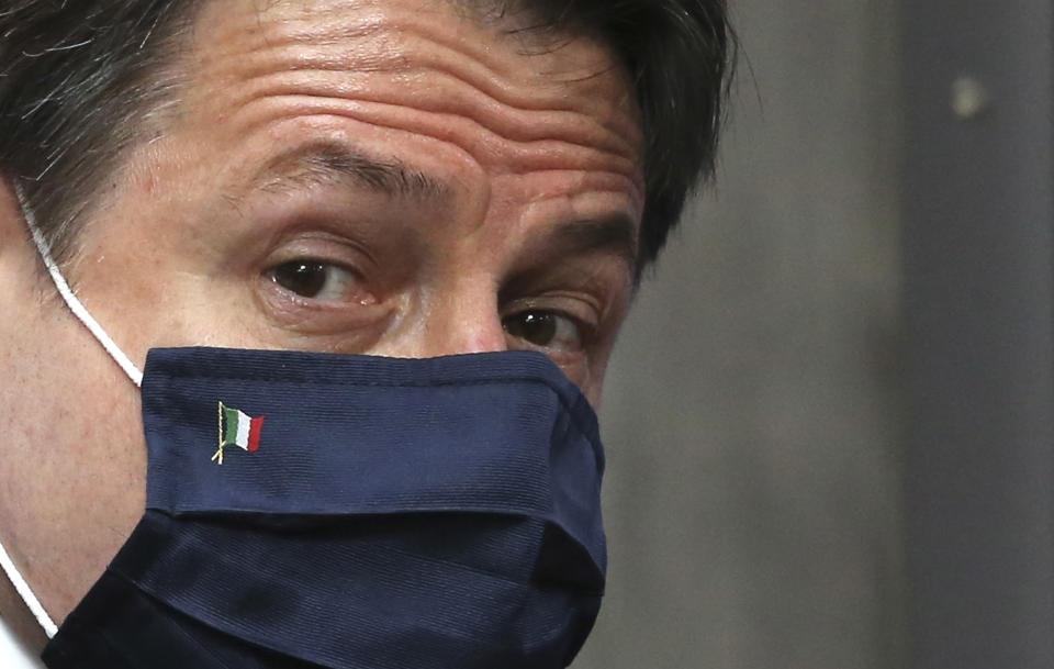 Italy's Prime Minister Giuseppe Conte arrives for an EU summit at the European Council building in Brussels, Sunday, July 19, 2020. Leaders from 27 European Union nations meet face-to-face for a third day to assess an overall budget and recovery package spread over seven years estimated at some 1.75 trillion to 1.85 trillion euros. (John Thys, Pool Photo via AP)