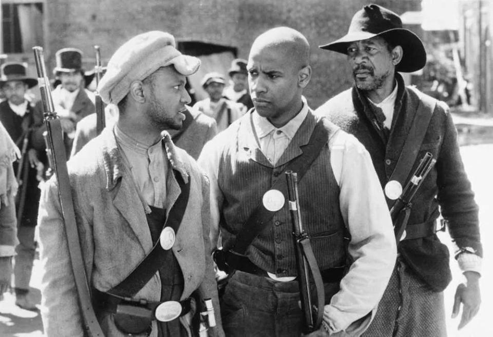 Actor Denzel Washington, center, is flanked by Jihmi Kennedy, left, and Morgan Freeman, right, in Tri-star Pictures movie “Glory” about black soldiers of the 54th Regiment who fought in the Civil War. March 5, 1990.