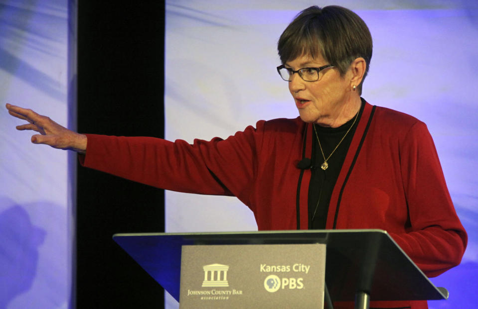 Kansas' Democratic Gov. Laura Kelly makes a point during a debate with GOP challenger Derek Schmidt on Wednesday, Oct. 5, 2022 in Overland Park, Kan. Kelly formed a racial justice commission in 2020 to examine policing and is now facing attacks from Schmidt for saying systemic racism in law enforcement needs to end. (AP Photo/John Hanna)