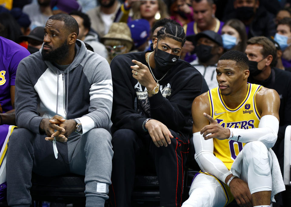 LeBron James, Anthony Davis and Russell Westbrook talk on the court.