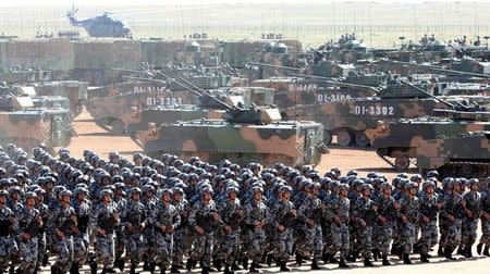 FILE PHOTO: Soldiers of China's People's Liberation Army (PLA) take part in a military parade to commemorate the 90th anniversary of the foundation of the army at the Zhurihe military training base in Inner Mongolia Autonomous Region, China, July 30, 2017. China Daily via REUTERS/File Photo