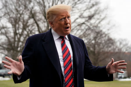 U.S. President Donald Trump talks to the media, ahead of his departure to Dover, Delaware, on the South Lawn of the White House in Washington, U.S., January 19, 2019. REUTERS/Yuri Gripas