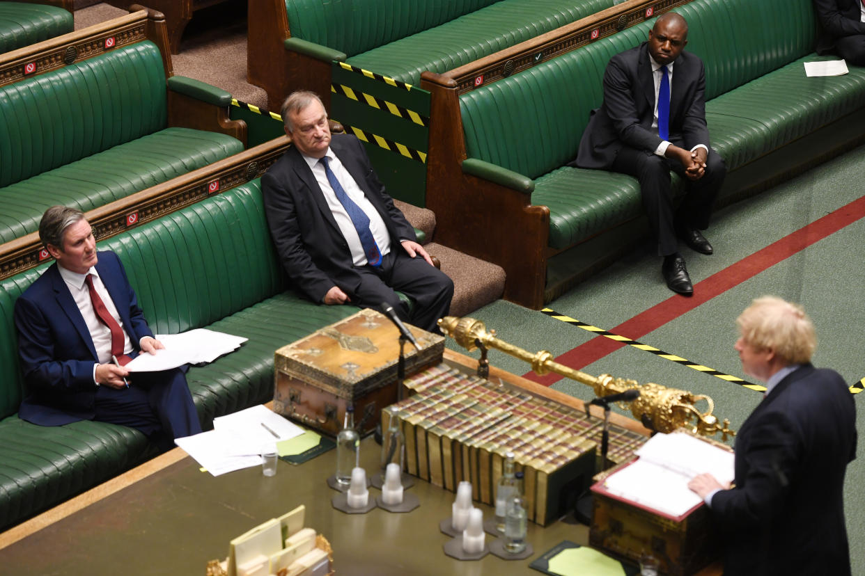 Britain's Prime Minister Boris Johnson speaks at the House of Commons during question period as opposition Labour Party leader Keir Starmer looks on, amid the coronavirus disease outbreak, in London, Britain May 20, 2020. UK Parliament/Jessica Taylor/Handout via REUTERS THIS IMAGE HAS BEEN SUPPLIED BY A THIRD PARTY. IMAGE CAN NOT BE ALTERED IN ANY FORM. MANDATORY CREDIT