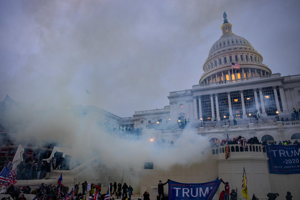 WASHINGTON,DC-JAN6: Tear gas is fired at supporters of President Trump who stormed the United States Capitol building.  (Photo by Evelyn Hockstein/For The Washington Post via Getty Images)