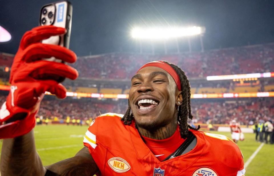 Kansas City Chiefs wide receiver Rashee Rice (4) records a video after the Chiefs defeated the Cincinnati Bengals 25-17 in an NFL football game at GEHA Field at Arrowhead Stadium on Sunday, Dec. 31, 2023, in Kansas City.