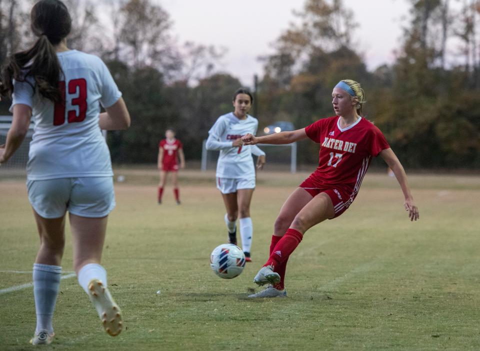 Mater Dei’s Morgan Wannemuehler (17) passes the ball as the Mater Dei Wildcats play the Washington Catholic Cardinals during the Class A girls soccer regional semifinal in Evansville, Ind., Thursday, Oct. 13, 2022. 