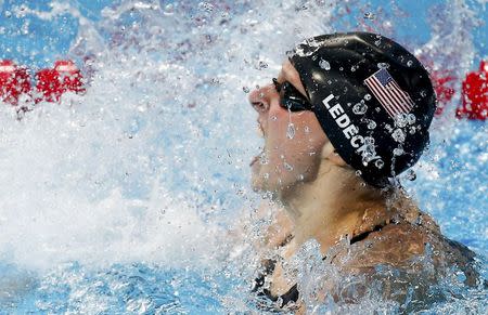 Katie Ledecky of the U.S. celebrates after setting a new world record and winning the women's 800m freestyle final at the Aquatics World Championships in Kazan, Russia, August 8, 2015. REUTERS/Michael Dalder