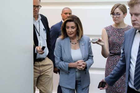 FILE PHOTO: U.S. House Speaker Pelosi arrives for a House Democratic caucus meeting at the U.S. Capitol in Washington