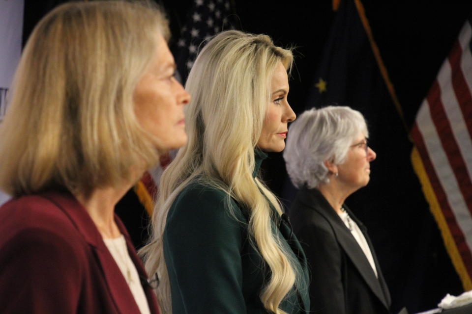 Republican Kelly Tshibaka, center, a Republican, looks on Thursday, Oct. 27, 2022, prior to a U.S. Senate debate in Anchorage, Alaska. She faces U.S. Sen. Lisa Murkowski, left, and Democrat Pat Chesbro, right, in the general election. (AP Photo/Mark Thiessen)