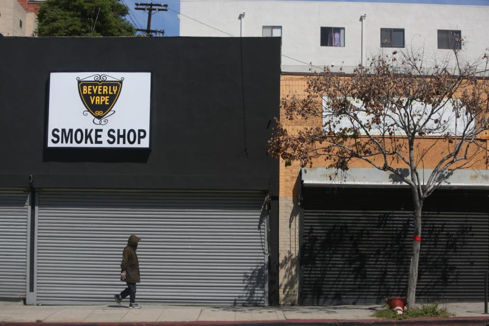 Ben Barcelona en route to his daughter's Koreatown apartment. The typically bustling urban neighborhood is largely deserted as Californians shelter at home for fear of catching the coronavirus.