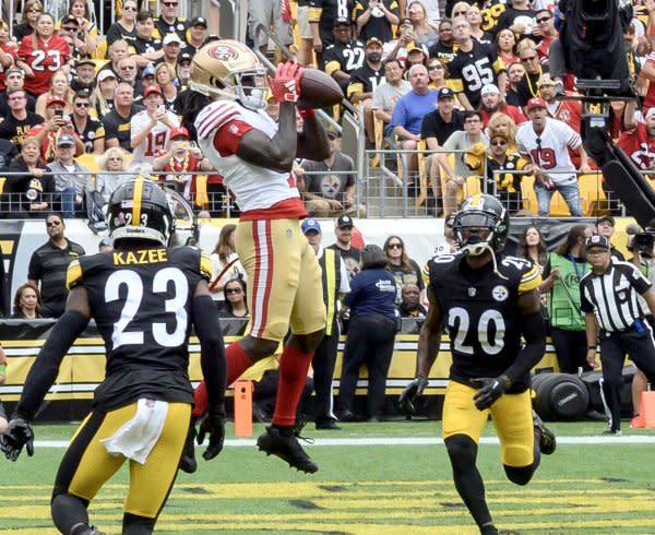 San Francisco 49ers wide receiver Brandon Aiyuk (C) makes a touchdown catch against the Pittsburgh Steelers on Sunday at Acrisure Stadium in Pittsburgh. Photo by Archie Carpenter/UPI