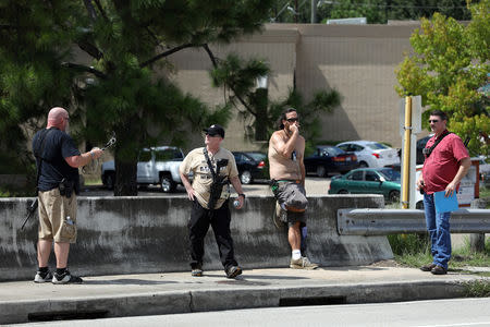 (From L) Open Carry Texas members Greg Holland, C.J. Grisham, Joseph Walker and David Amad openly carry firearms in Houston, Texas, U.S., September 24, 2018. Picture taken September 24, 2018. REUTERS/Loren Elliott