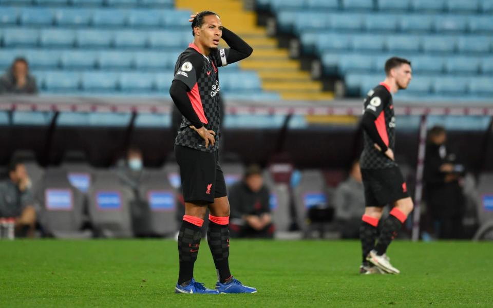 Liverpool's Virgil van Dijk reacts after Aston Villa's Jack Grealish scores his side's sixth goal during the English Premier League soccer match between Aston Villa and Liverpool - EPA