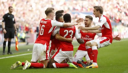 Britain Football Soccer - Arsenal v Manchester City - FA Cup Semi Final - Wembley Stadium - 23/4/17 Arsenal's Alexis Sanchez celebrates scoring their second goal with team mates Action Images via Reuters / Carl Recine Livepic