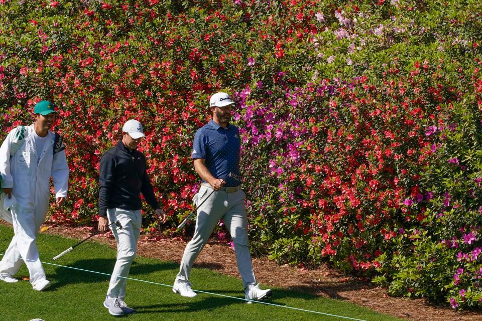 Rory McIlroy and Dustin Johnson stride down the sixth fairway Monday during a practice round for the Masters golf tournament at Augusta National Golf Club. [Michael Madrid-USA TODAY Sports]
