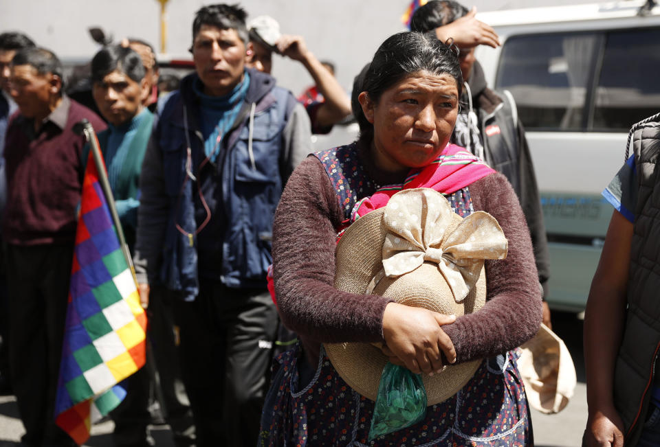 A woman takes part in a funeral procession for people killed in clashes between supporters of former President Evo Morales and security forces, in La Paz, Bolivia, Thursday, Nov. 21, 2019. At least eight people were killed Tuesday when security forces cleared a blockade of a fuel plant by Morales's backers in the city of El Alto. (AP Photo/Natacha Pisarenko)