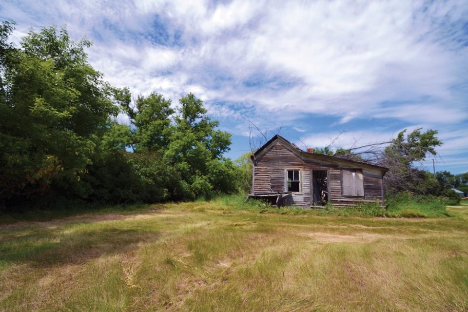 This abandoned house photographed by Troy Larson for the book "Ghosts of North Dakota Volume 2" is located near Barton, N.D., in the northern part of the state. (AP Photo/Troy Larson)