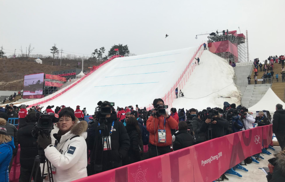 As a snowboarder skies, cameras look for Ivanka Trump. (Jay Busbee/Yahoo)