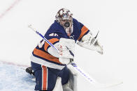 New York Islanders goalie Semyon Varlamov makes a save against the Tampa Bay Lightning during the first period of Game 3 of the NHL hockey Eastern Conference final, Friday, Sept. 11, 2020, in Edmonton, Alberta. (Jason Franson/The Canadian Press via AP)