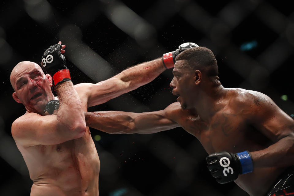 United States' Jamahal Hill, right, competes with Brazil's Glover Teixeira in a light heavyweight title bout at the UFC 283 mixed martial arts event in Rio de Janeiro early Sunday, Jan. 22, 2023. (AP Photo/Bruna Prado)