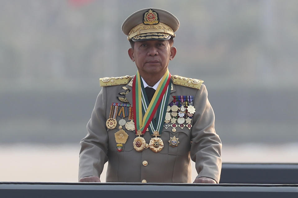FILE- Senior Gen. Min Aung Hlaing, head of the military council, inspects a parade, marking Myanmar's 78th Armed Forces Day in Naypyitaw, Myanmar, March 27, 2023. Myanmar’s ruling military council on Wednesday, May 3, 2023, said it was releasing more than 2,100 political prisoners as a humanitarian gesture. Thousands more remain imprisoned on charges generally involving nonviolent protests or criticism of military rule, which began when the army seized power in February 2021 from the elected government of Aung San Suu Kyi. (AP Photo/Aung Shine Oo, File)