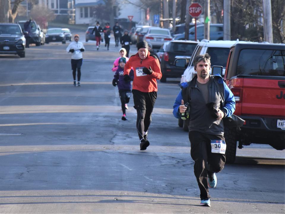 Runners on Gansevoort Street approach the end of the Little Falls' fifth annual Turkey Trot Thursday.