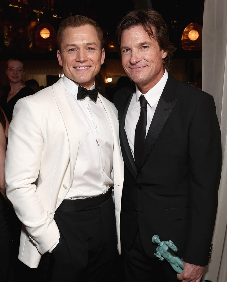 Taron Egerton congratulates Jason Bateman on his SAG Award win during People's official Screen Actors Guild Awards afterparty at Fairmont Century Plaza in Los Angeles on Feb. 26, 2023.
