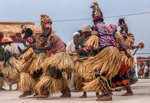 Masked dancers in Malawi - Credit: Getty