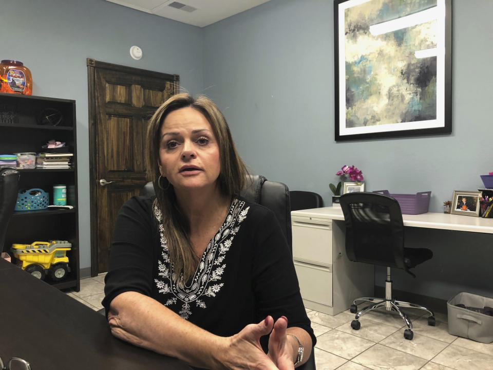 In this Oct. 30, 2019, photo, Sherry Russell discusses the death of her son at the Gallia County Jail in southern Ohio at her medical care business in Rio Grande, Ohio. Russell wants to know how her son was able to commit suicide while kept in an isolation cell that was supposed to be under constant surveillance. (AP Photo/Mark Gillispie)