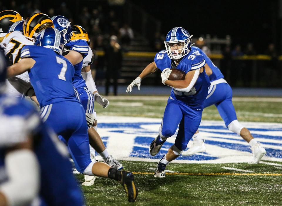 Caldwell's Joey Marinello runs the ball during the first half of a football game at Caldwell High School on Oct. 14, 2022.