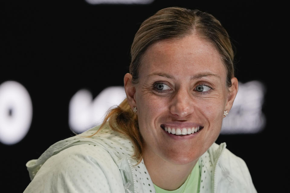 Germany's Angelique Kerber reacts during a press conference ahead of the Australian Open tennis championships at Melbourne Park, Melbourne, Australia, Friday, Jan. 12, 2024. (AP Photo/Mark Baker)
