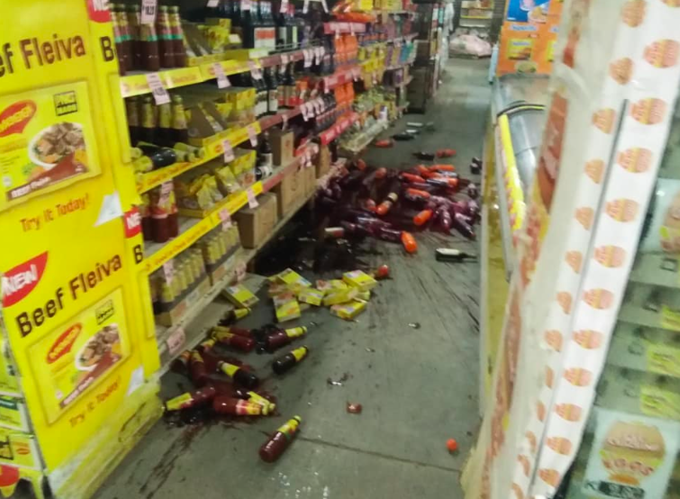 Items are seen splattered across the floor of a supermarket. Source: Twitter