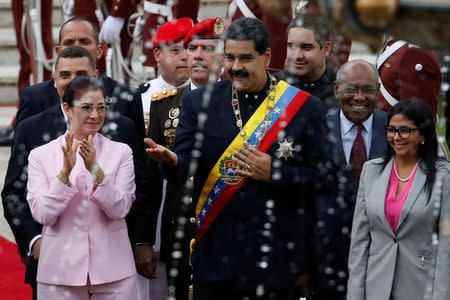 Venezuela's President Nicolas Maduro (C), his wife Cilia Flores (L) and National Constituent Assembly President Delcy Rodriguez (R) arrive for a session of the assembly at Palacio Federal Legislativo in Caracas, Venezuela August 10, 2017. REUTERS/Carlos Garcia Rawlins