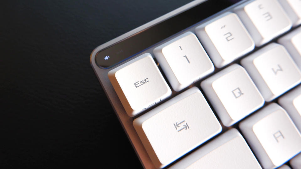 The ROG Falchion RX gaming keyboard in white set up on a desk.