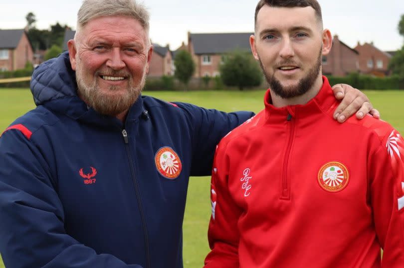 A picture of Niall Currie welcoming new signing Jamie McDonagh