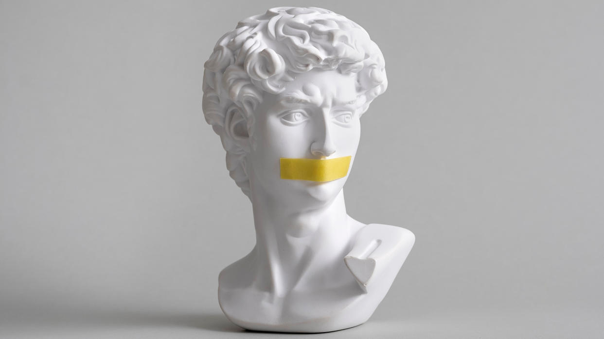  Michelangelo's 'David' head bust, with a piece of yellow tape covering the mouth. 