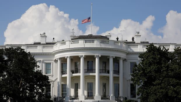 White House flag at half-mast.