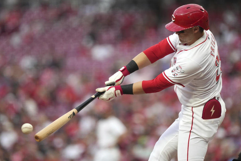 Cincinnati Reds' TJ Friedl hits a single during the third inning of a baseball game against the St. Louis Cardinals, Tuesday, Aug. 13, 2024, in Cincinnati. (AP Photo/Kareem Elgazzar)